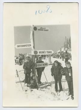 Children Standing by Trail Sign